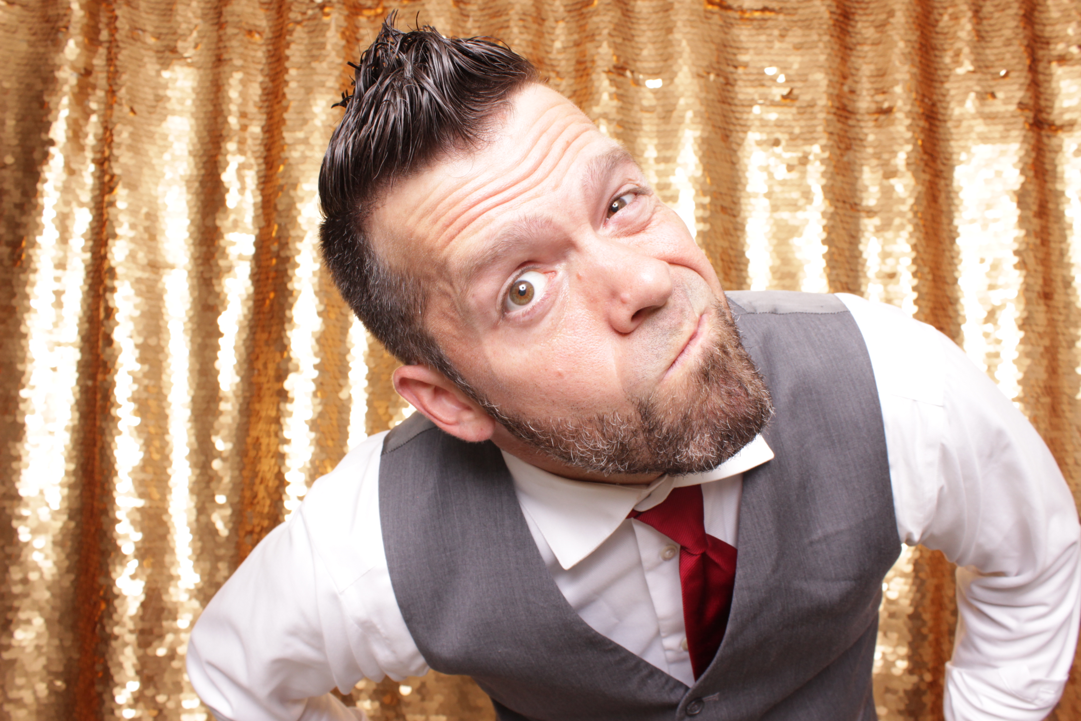 DJ Kyle Mac professional headshot with golden sequin backdrop